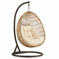 Hängesessel Rattan mit Stahlgestell und beigem Kissen
